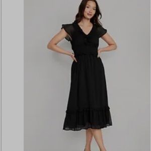 Waist defined, flutter sleeve, midi dress. Never worn, tags still on.